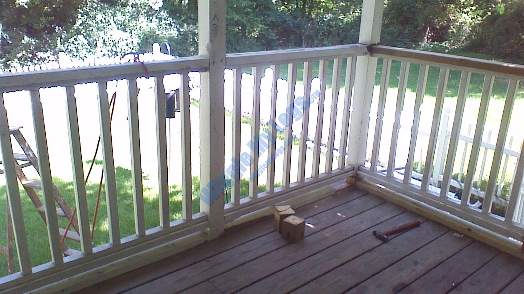 Old screens off, looking out a bit right, showing some baseboard and handrail replacement.