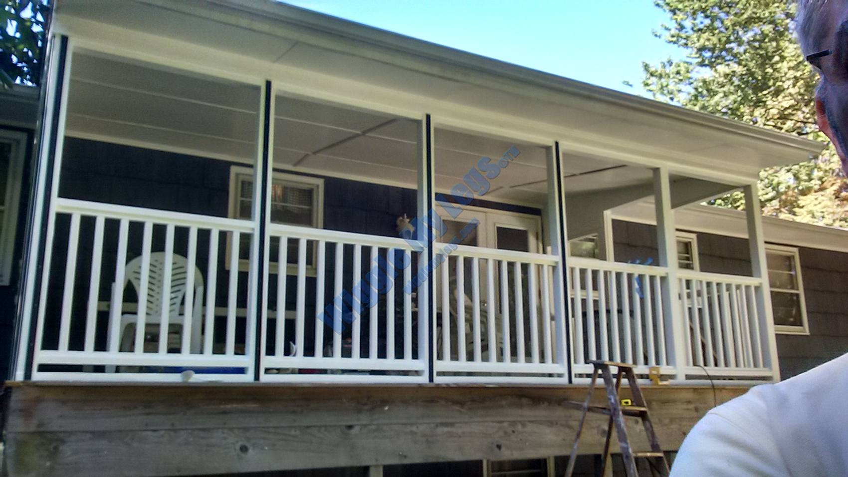 Vertical black plastic tracks for splines almost complete across long side of deck.