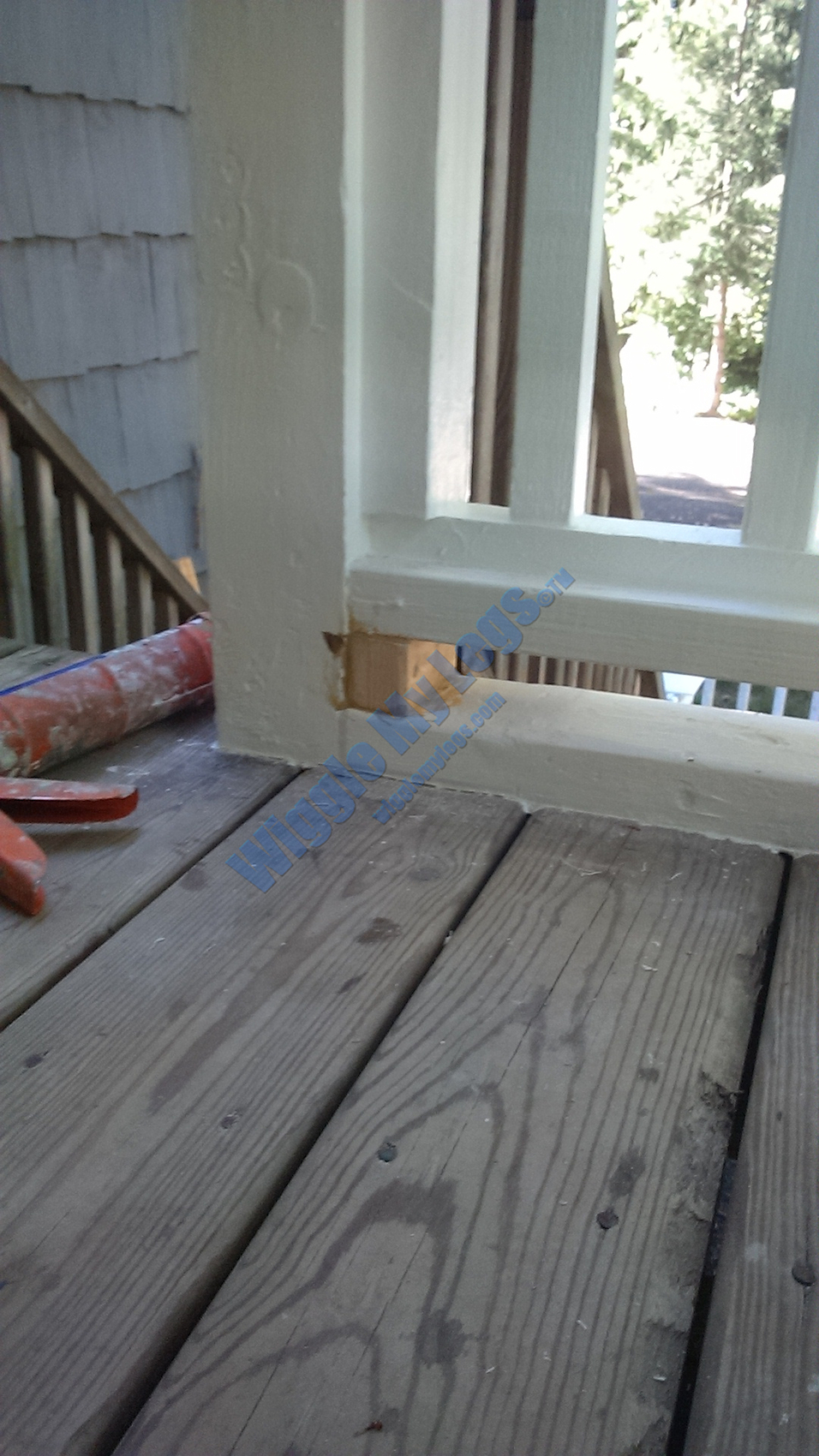 Wood plug to fill gap between baseboard (sill) and bottom rail, for continuity under black plastic spline track.