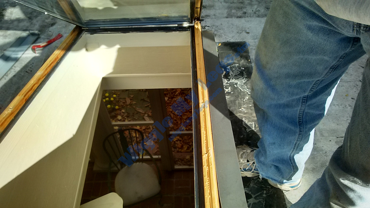 Lifting the glass off the first skylight closer to the house.