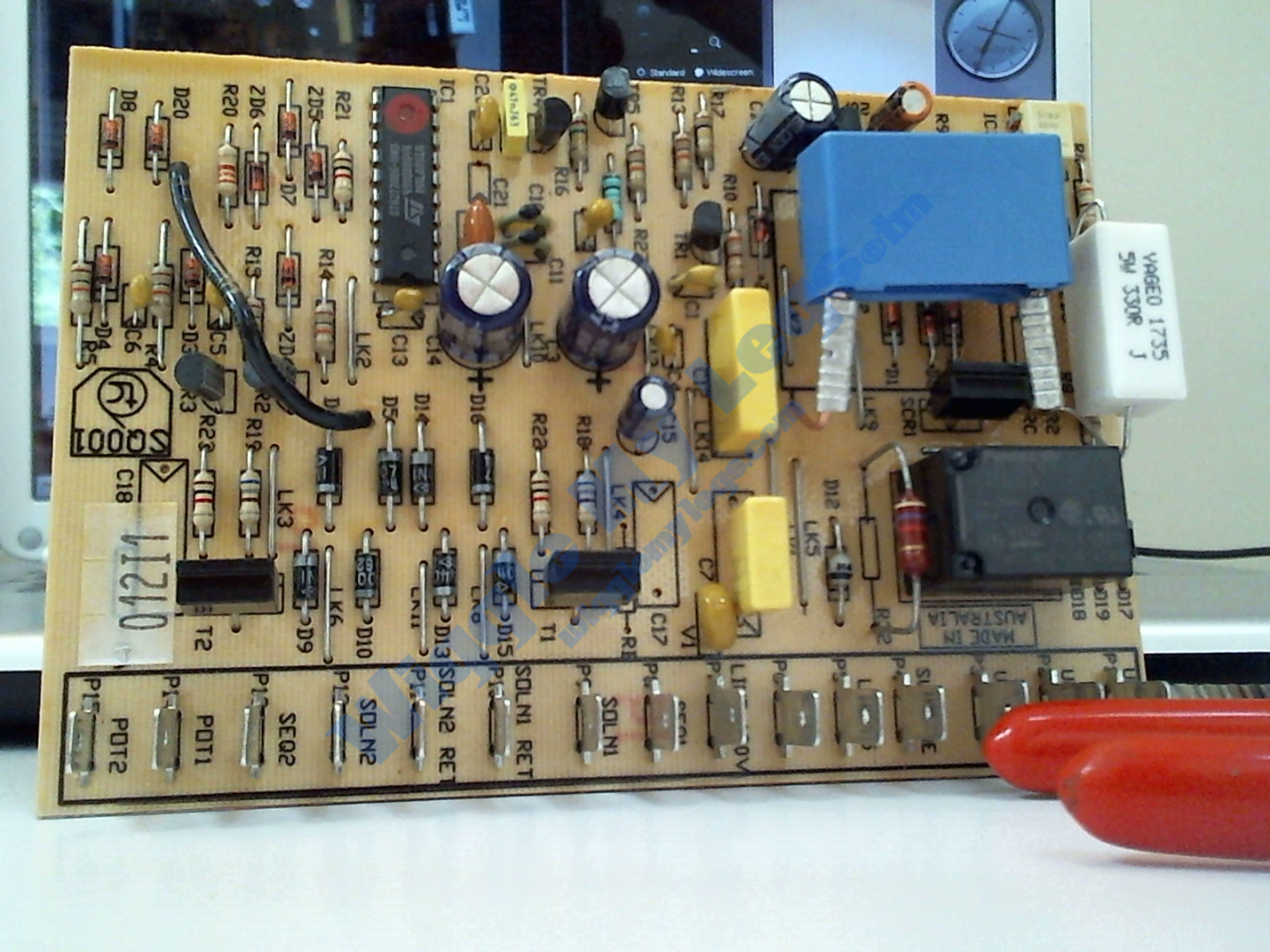 Photo of the component side of the repaired PCB.